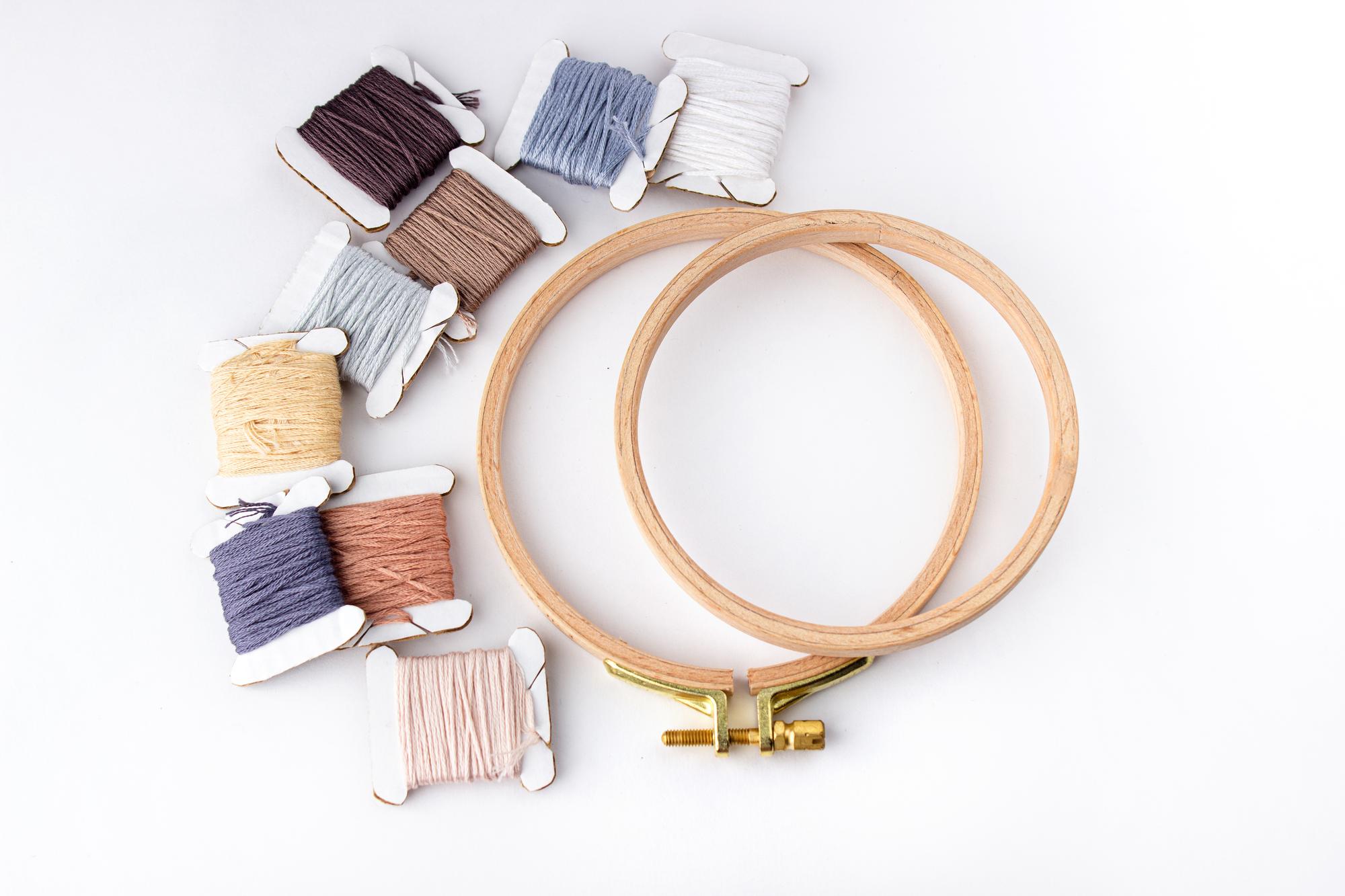 Close-up embroidery hoop with pastel threads